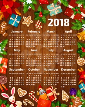 2018 calendar design of Christmas and New Year decorations, Santa gifts and Christmas tree garland. Vector calendar template of golden bell on holly wreath, gingerbread cookie and winter snowflakes