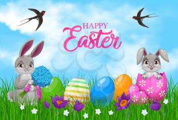 Easter bunnies with eggs and flowers. Vector Easter egg hunt rabbits and painted gifts on green grass field with spring crocus flowers, floral bouquet and swallow birds in blue sky, greeting card