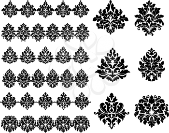 Collection of black silhouetted floral and foliate design elements as arabesques