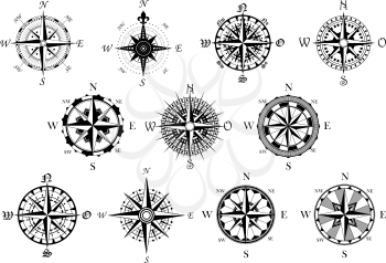 Vector antique compasses with ornate dials for use as design elements in vintage or retro nautical and marine concepts, black and white