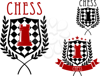 Chess tournament emblems or badges including red rook on chessboard shield, decorated with laurel branches, stars and ribbon banner
