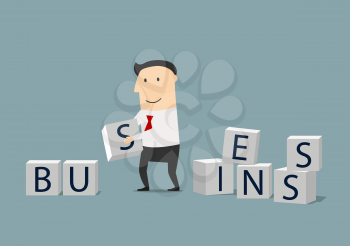 Build your own business or startup concept. Smiling focused businessman building a word Business from cubes with letters