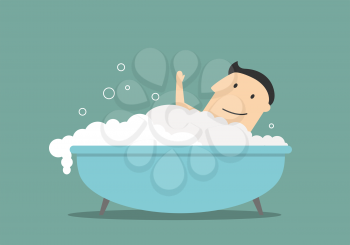 Happy smiling businessman relaxing in a bathtub with foam