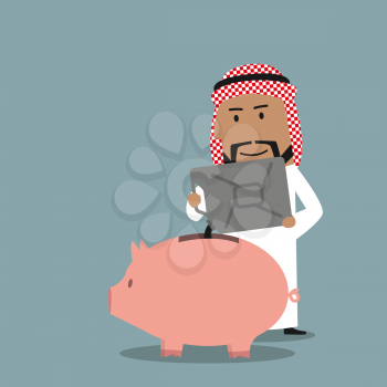 Successful wealthy arabian businessman pouring oil from a jerry can into a piggy bank to save proceeds from the sale of crude petroleum. Financial concept of savings or investment