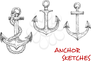 Old nautical anchors of medieval sailboats or pirate ships, decorated by ropes. May be used as t-shirt print, navy symbol or adventure design. Sketch style