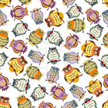 Cartoon seamless pattern of colorful owls on tree branches with ornamental striped and spotted feathering, lush eyebrows and glasses. Great for education concept or kids room interior design