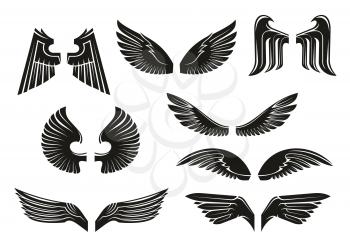 Black heraldic wings set in tribal style for tattoo and book, heraldry or religious design isolated on white. Vintage or retro birds and angel wings