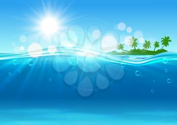 Tropical island background with marine landscape of over and under water surface with green silhouette of island with palms at the horizon and blue waves with sun and flare spots.
