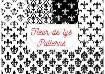 Fleur-de-lis seamless patterns set. Black and white vintage backgrounds set with royal victorian fleur-de-lis ornament. Vintage interior or wallpaper design