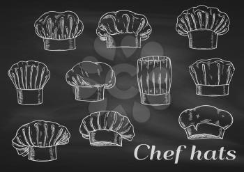 Chef toques, hats. Chalk sketch on blackboard. Cook caps icons of different shapes and forms for restaurant decoration, bakery elements, kitchen design