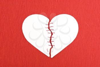 Royalty Free Photo of a Broken Heart and Threads