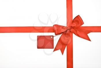 Royalty Free Photo of a Red Bow With Label