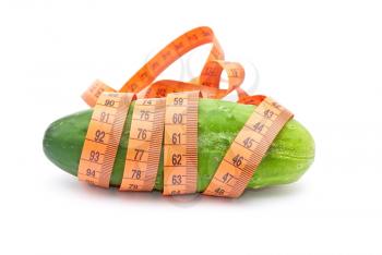 Royalty Free Photo of a Cucumber and Measuring Tape