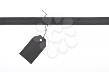 Royalty Free Photo of a Black Ribbon With Label