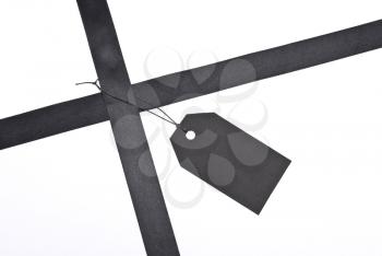 Royalty Free Photo of a Black Ribbons With Label