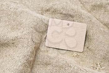 Royalty Free Photo of Sackcloth and a Cardboard Tag