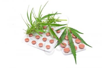 Cannabis leaf with tablets 