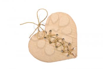 Royalty Free Photo of a Torn Cardboard Heart Stitched With Rope