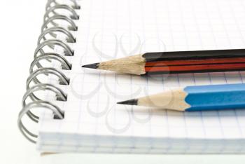 Royalty Free Photo of a Spiral Notepad With Pencils