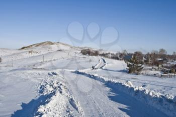 Royalty Free Photo of a Winter Road in a Village
