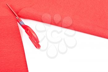 Royalty Free Photo of Scissors Cutting Red Paper
