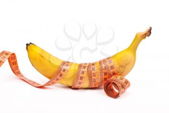 Royalty Free Photo of a Banana With Measuring Tape