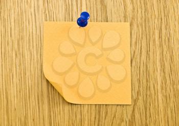 Royalty Free Photo of a Blank Tag on a Wooden Background