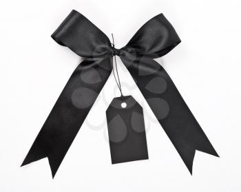 Royalty Free Photo of a Black Bow With Label