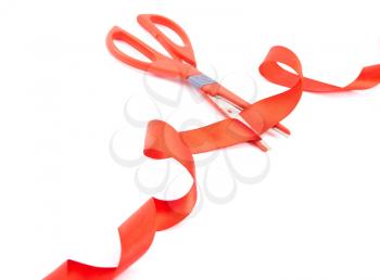 Royalty Free Photo of Scissors Cutting Red Ribbon