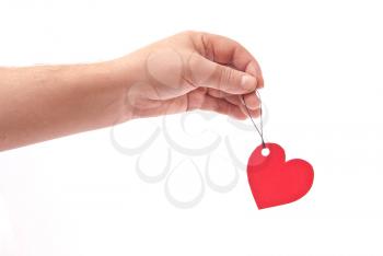 Hand with red heart tag 