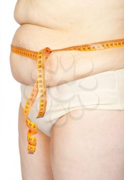 Fat woman measuring her stomach