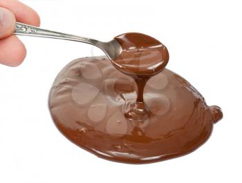 Royalty Free Photo of a Puddle of Melted Chocolate With a Hand Spooning the Chocolate