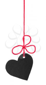 Royalty Free Photo of a Heart Silhouette Hanging From a Red String