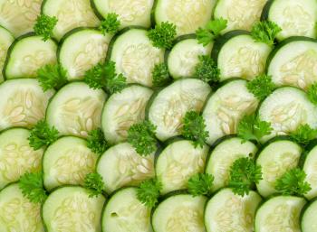 Freshly sliced cucumber with lettuce