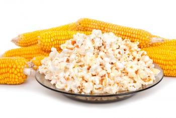Popcorn on a plate and cobs