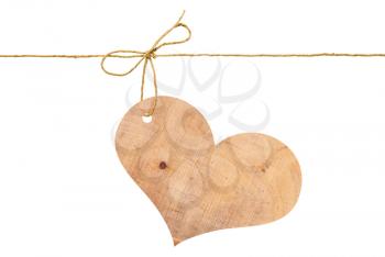 Wooden heart on a rope with a bow