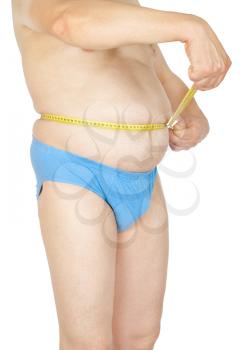 Fat man holding a measurement tape 