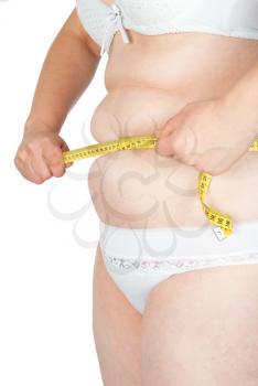 Fat woman measuring her stomach