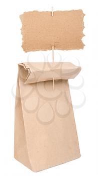 Paper bag with cardboard sign