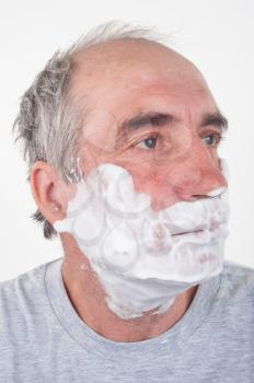 Man shaves his face