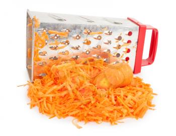 Pile of grated carrots and graterr