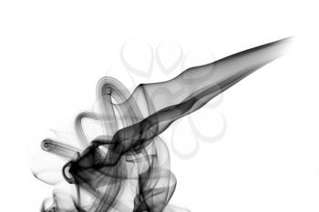 Abstract black fume swirls over the white background