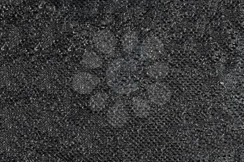 Black ornamental fabric with sparkles. Useful as background 