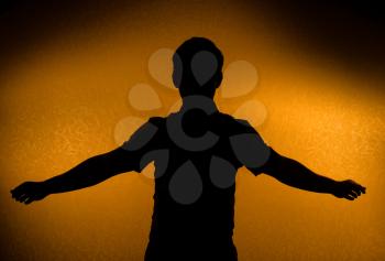 Breakthrough - male silhouette with opened arms (back light)