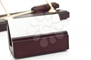 Card holder, blank white business card and two beautiful pens on stand on the background over white