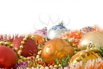 Christmas greetings - colorful decoration balls and beads over white