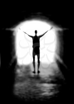 Blurred Human silhouette against the light of tunnel exit background (shallow DOF)
