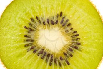Green isolated kiwi fruit slice - Extreme closeup 