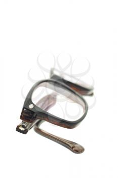 Modern eyeglasses over white background (shallow DOF)