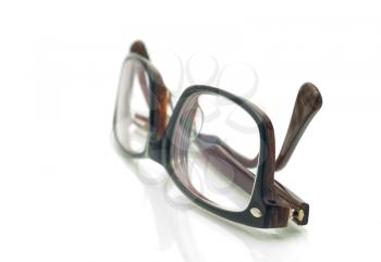 Modern plastic eyeglasses over white background (shallow DOF)